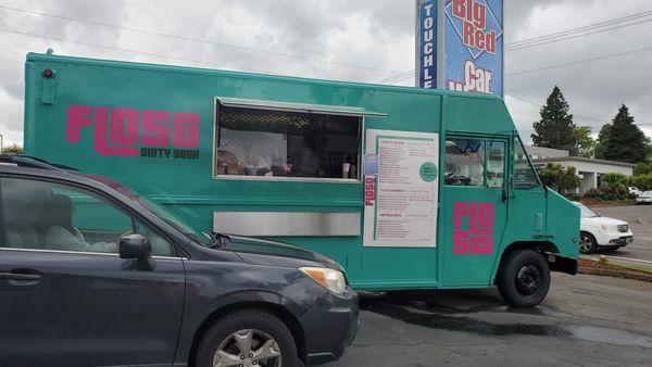 The FLOSO food truck the the parking lot of the car wash next door