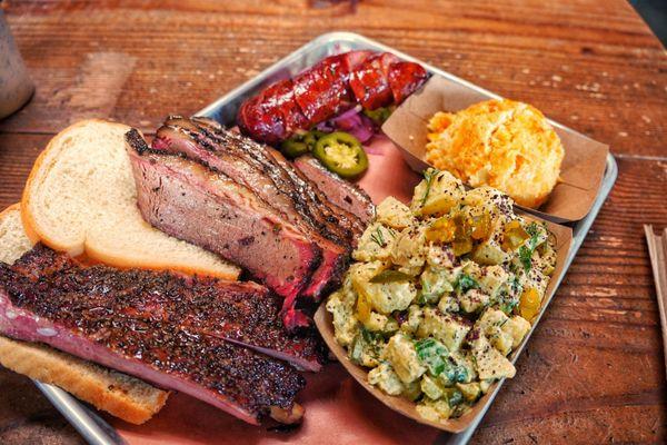 Brisket, ribs and jalapeño cheeder sausage with corn casserole and potato salad