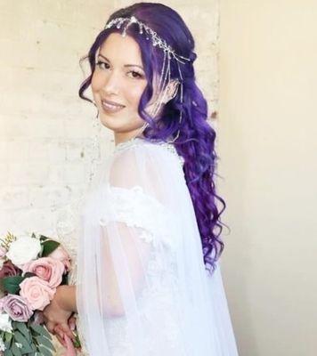 Purple vivid with extensions along with her wedding up style