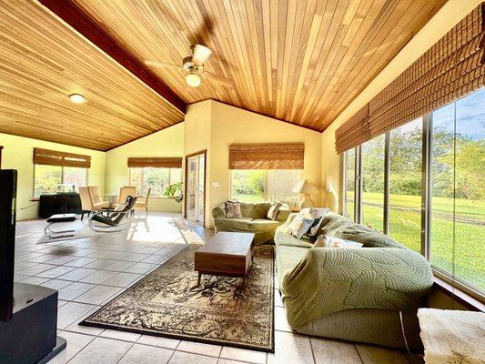 So much sunlight! Abundant space with 14-foot vaulted redwood ceilings throughout.