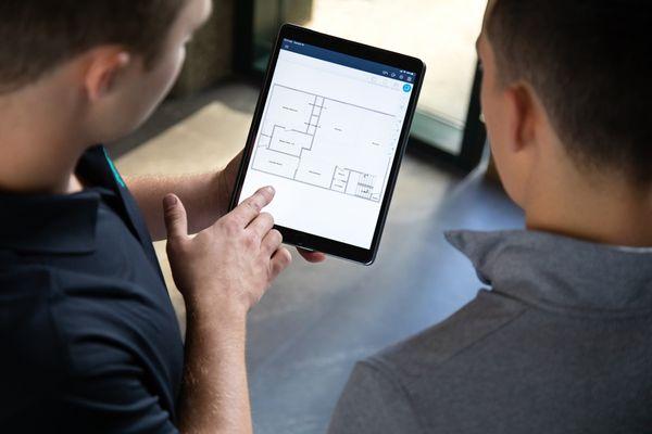 Discussing restoration project and scope of work with client before proceeding to ensure transparency.