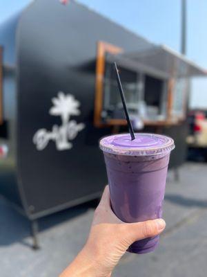 White chocolate ube cold brew with soft top and toasted coconut