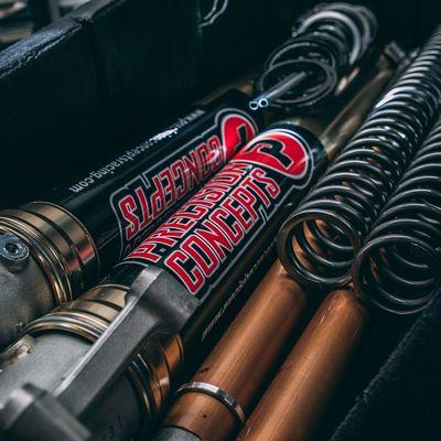 Dirt bike suspension being worked on at Precision Concepts Racing