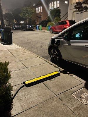 No garage, I'm now able to charge my car while street parking