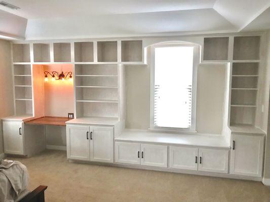 Custom built-in shelves and cabinets.