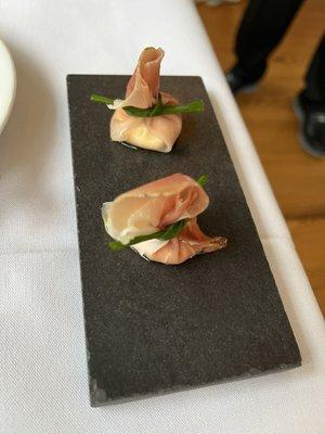 Amuse bouche - "purse" of smoked prosciutto and marscapone cheese tied with chive