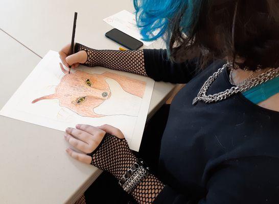 Student creating at Catherine Carter Art School, a program of art classes in drawing and painting for children and teens in New Bedford.