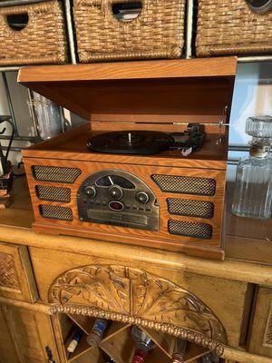 Beautiful items like this beautiful record player/receiver that has an antique look. Play records in style with this conversation piece.