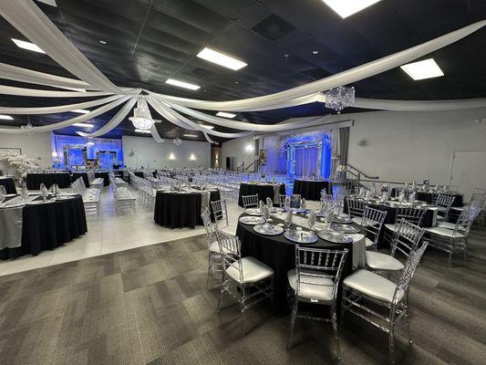 Set up with chairs in the center for the service. The staff moved all of the chairs and tables after the service and before the meal.