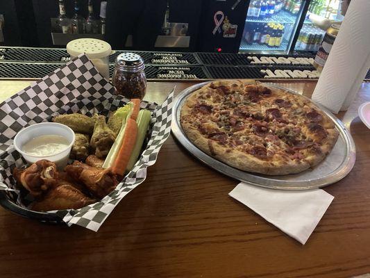 Meat Lovers Pizza and wings (half Buffalo half lemon pepper)