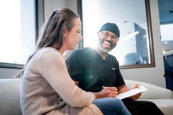 Dr. Walt Sweeney with patient in the front lobby