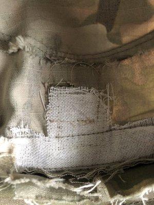 Asked to cut out the white mesh before sewing rank patch on. They didn't even bother to do that. Now it's sewn into the crooked rank patch