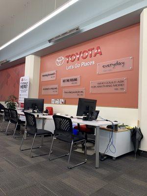 All the different Toyota mottos over time on the wall