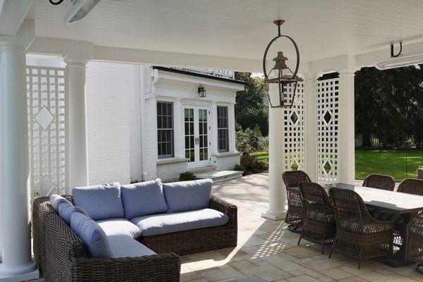 Luxury outdoor living under a custom pavilion with lattice details