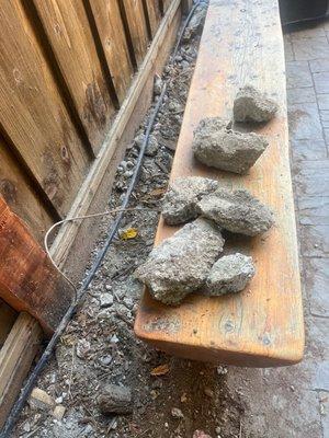 Huge pieces of concrete that were left behind. Also my landscaping plastic pipe is now exposed when it was buried before