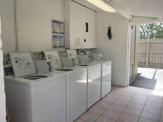 Laundry area, we have 4 washers , 6 dryers. And a table to fold your clothes on.