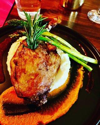 Duck l' orange over divine mashed potatoes with sweeps of decadent sauce!