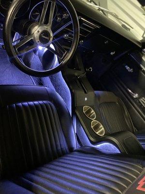 Center console with brush-guard gear slot and aluminum cup holders.