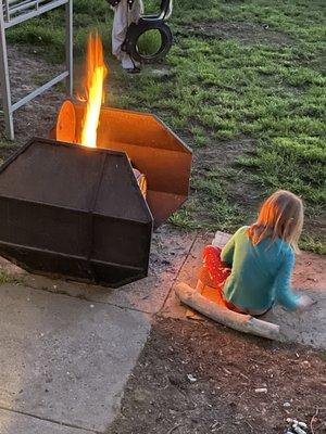Daughter enjoying fire pit after we made s'mores