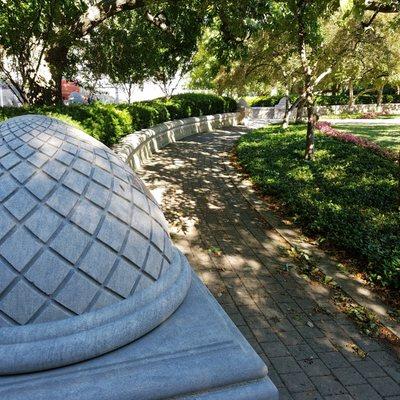 brick walkway around the circle with terraced beddings