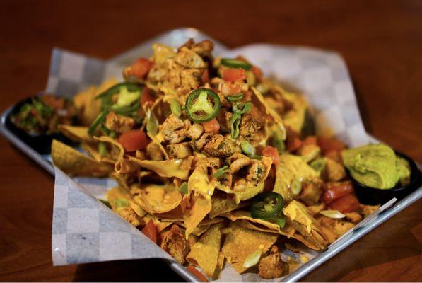 Cheesy chicken loaded nachos with house made chips