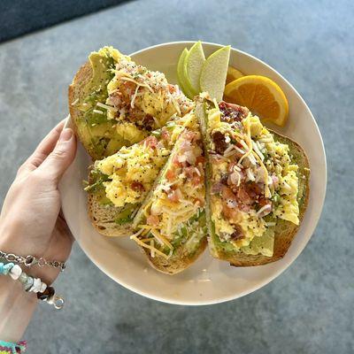 "Loaded Avocado Toast" toast, avocado, bacon, cheesy scrambled eggs, pico de gallo