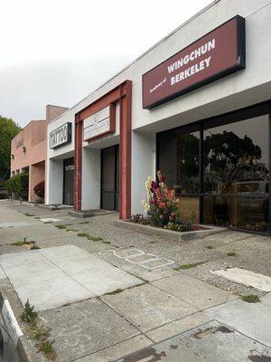 It's the store with the red archway next to the tattoo place.