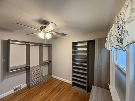 Walk-in closet transformation. The wall space is for a future door into an updated master bathroom.