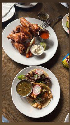 Wings and chicken taco and steak taco.