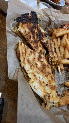 Burnt chicken quesadilla with no flavor.