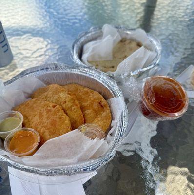 Front is a trio of empanadas and the back were outrageously good pupusas.