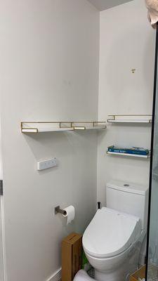 Installing shelves on the wall.