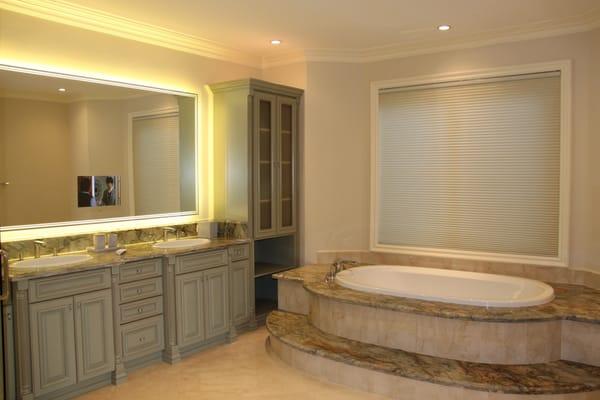Vanishing Seura Mirror TV in the bathroom with LED lights.