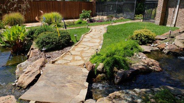 Pathways and creek bed leading to pond.