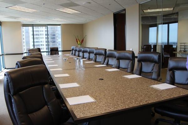 Multi-use conference room with several table variations.