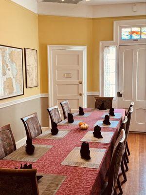 Dining room with the bathroom in the corner.