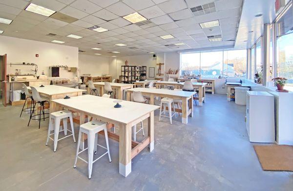 View of the studio. You can see our tables for handbuilding work, designed and built by us and our friends.