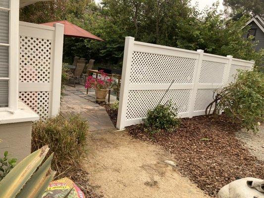 Vinyl lattice fence for the back yard.