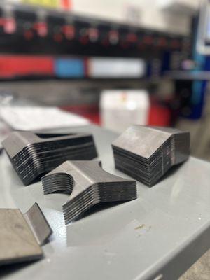 Custom CNC bent 1/8" hot rolled pickled and oiled steel parts