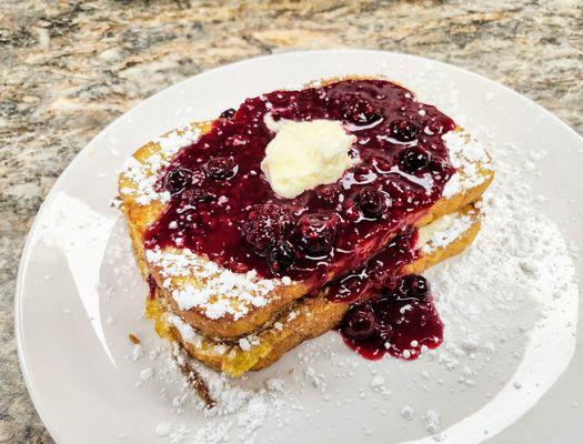 French toast stuffed with cream cheese and covered with mixed berries