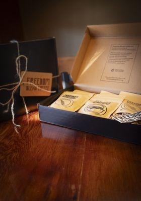 Each gift box contains two-ounce samples of medium roast, dark roast, light roast), and Espresso.