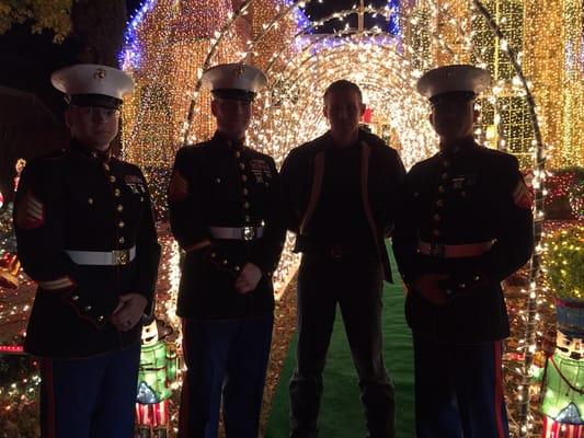 Marines collecting toys during a Toys For Tots drive during a Christmas lights display in Texas, stop to pose with me to support our cause.