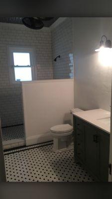 Newly installed pipes for bathroom sink, toilet, and shower