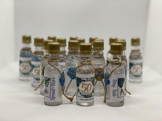 Custom mini hand sanitizer bottles with wax seal embellishments. Sponsored gift by Party Over Here.
