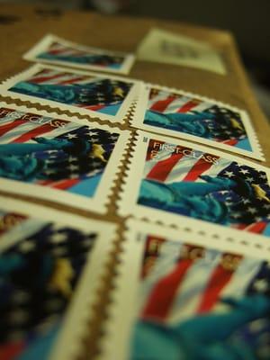 Besides shipping USPS packages, we carry rolls of 100 stamps, books of 20 stamps, & sell them individually for your convenience.