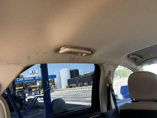 Black grease finger / hand prints on my cream roof lining