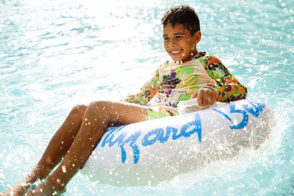 Blizzard Beach guest tubing in water park.