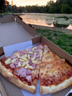 Delish takeout--2 slices of pizza (1 cheese, 1 w/ham & pineapple add-on). Enjoyed it seated by Children's Lake @ sunset.