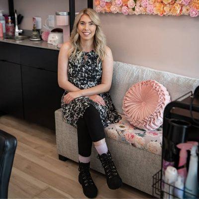 Becky enjoying her comfortable salon suite with her usual bubbly personality