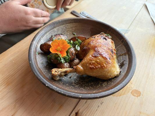 Roasted chicken thighs with a perfect crispy skin and roasted potatoes.